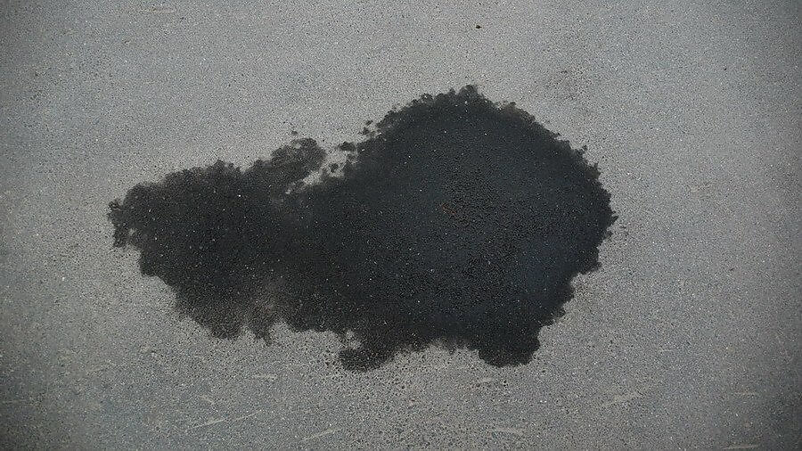 remove oil stains from driveway